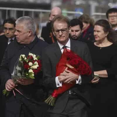 Ambassadors lay flowers at site of Russia hall massacre