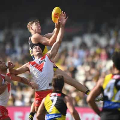 Tigers upset Swans to give Yze first win as coach