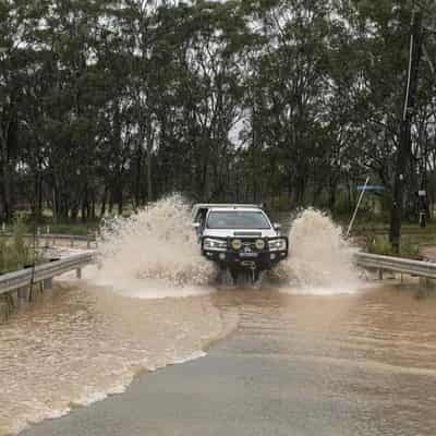 Chaos as Sydney drenched with month of rain in 16 hours