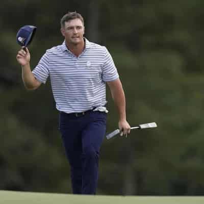 DeChambeau claims Masters lead with birdie blitz