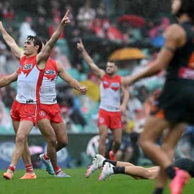 Swans cruise to wet weather derby win over Giants