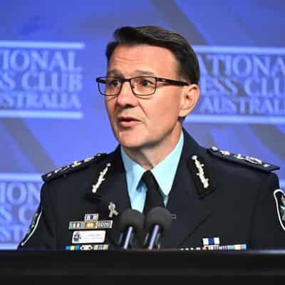 Federal police commissioner gets two more years in role