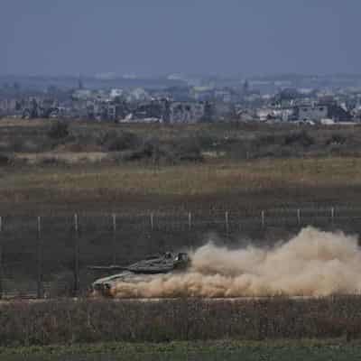 Israeli forces push into Gaza from north and south