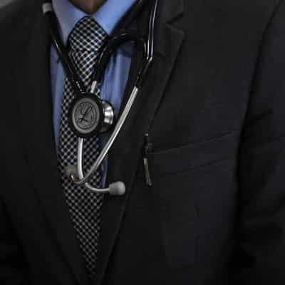 Doctor charged with indecently assaulting woman