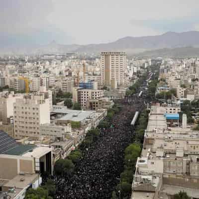 Mourners pack Iranian holy city for Raisi burial