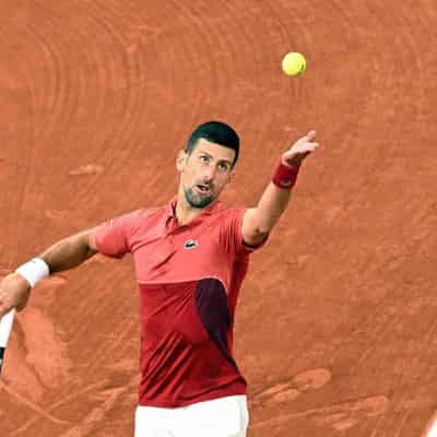 Heckler helps Djokovic finds mojo with French Open rout