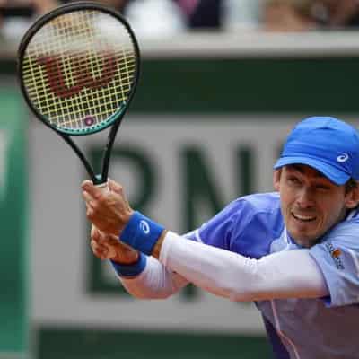 De Minaur won't be pushed around by big hitter Struff