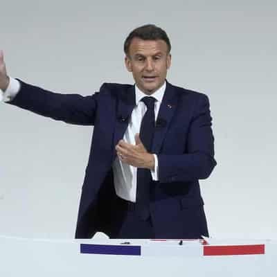 France's Macron asks rivals to unite against far right