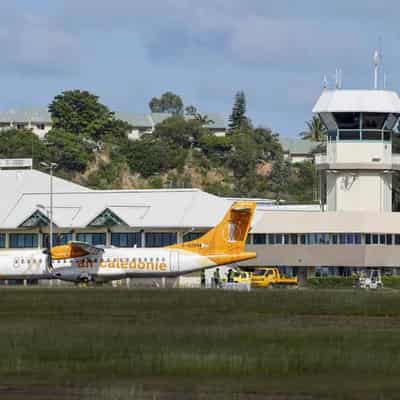 New Caledonia to reopen airport, shorten curfew