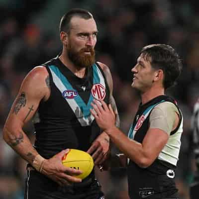 Butters cleared at AFL Tribunal, Dixon to fight charge