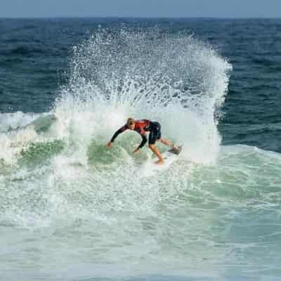 Ewing thrives in Rio surf, Robinson a shock casualty