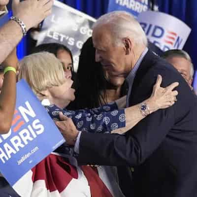 Biden carries on campaigning as Democrats mull options