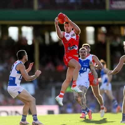 Many happy returns as star Swans help crush Kangaroos