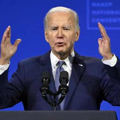 Biden pledges 'I am all in', criticises Trump policies