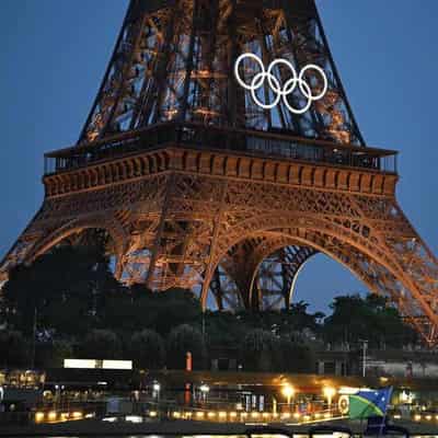 Celine Dion serenades Paris in sodden start to Olympics