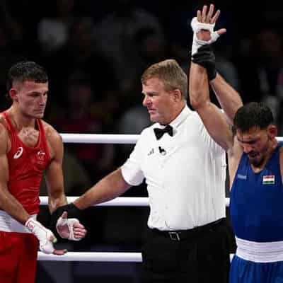 Garside rocked by boxing loss as giant Aussie triumphs