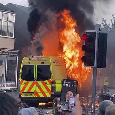 UK police hurt in violent riot after three girls killed