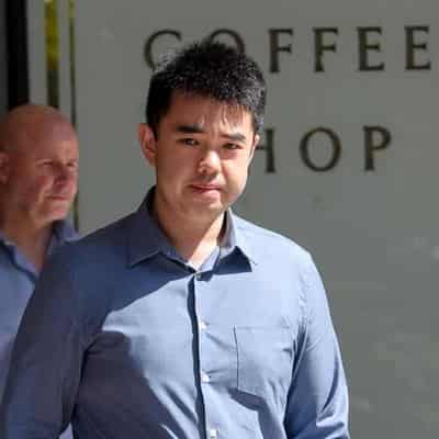 Doctor charged over lewd patient photos set for custody