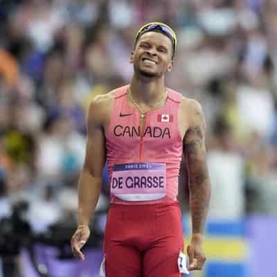 Olympic champion De Grasse to run without banned coach