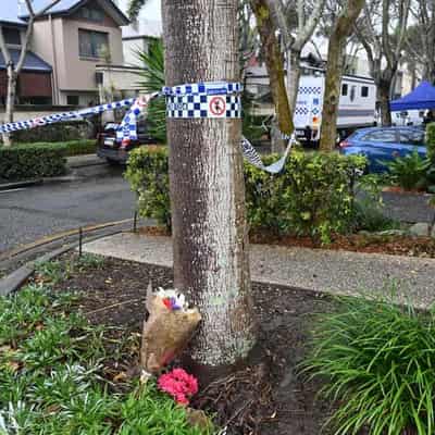 Vigil for slain girl as community embraces stricken dad