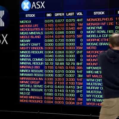 Aussie shares dip as banks drag, BHP and Woodside gain