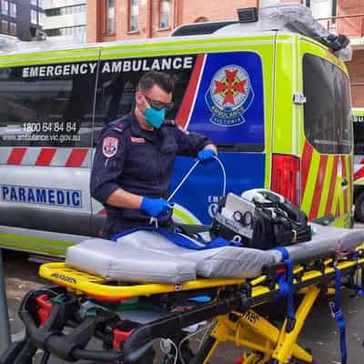 Paramedics treat patient in hospital amid pay dispute