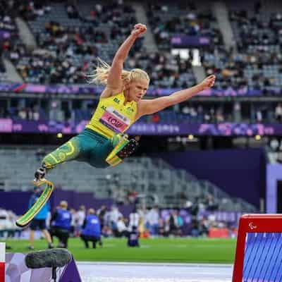 Low claims long jump gold as Ballard goes on attack