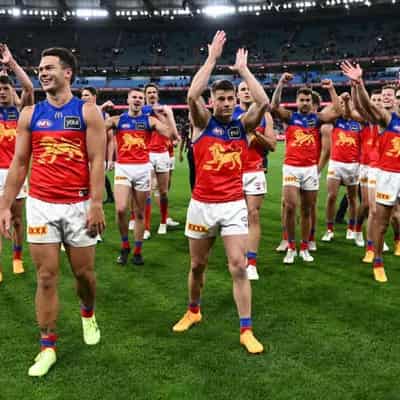 Lions roar into AFL grand final, but lose injured ruck