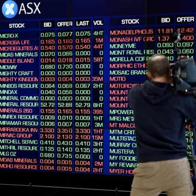 Aussie shares edge lower after RBA keeps rates on hold