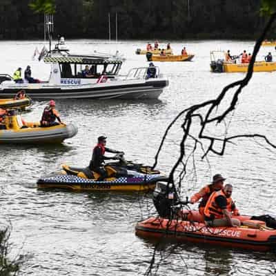 Police probe deaths of mother and two children in river