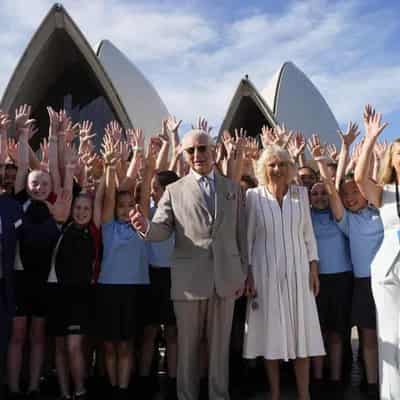 Thousands queue to but see the royals passing by