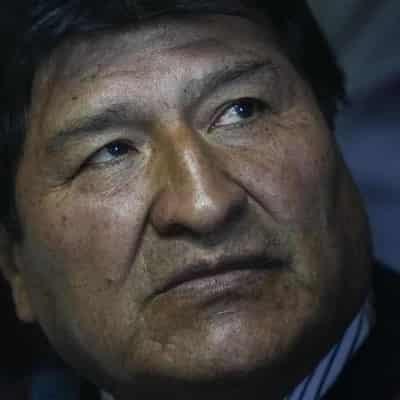 Bolivia's ex president's car shot at as tensions flare