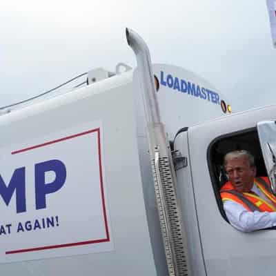 Trump boards garbage truck to highlight Biden comment