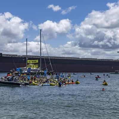 Climate protest flotilla descends on biggest coal port