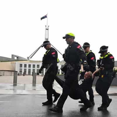 Moment climate protesters detained at parliament house