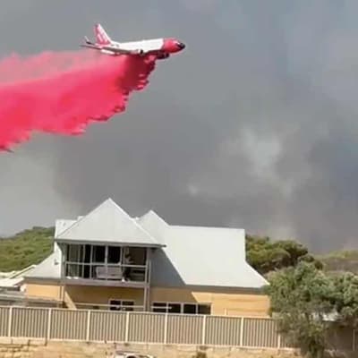 Fire threat eases but residents warned not to return