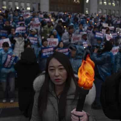 S.Korea's Yoon faces impeachment vote and treason probe