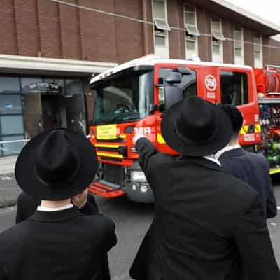 Synagogue arson attack sparks manhunt, security plea