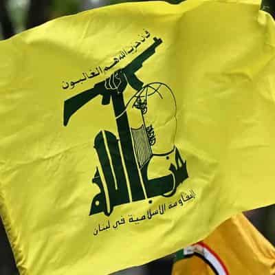 Protester charged for alleged display of Hezbollah flag