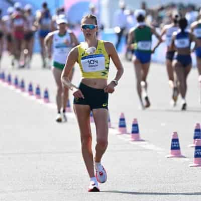 Olympian shrugs off early blow to take race walk title