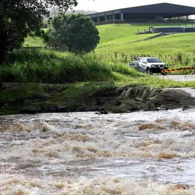 Two rescued as flooding rains move south