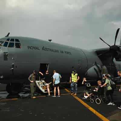 Australians return home as Vanuatu rescues continue