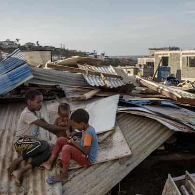 Macron swears in angry exchange in cyclone-hit Mayotte