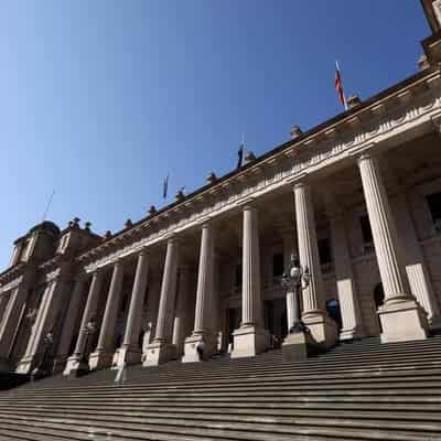 Police probe anti-Semitic banner on steps of parliament