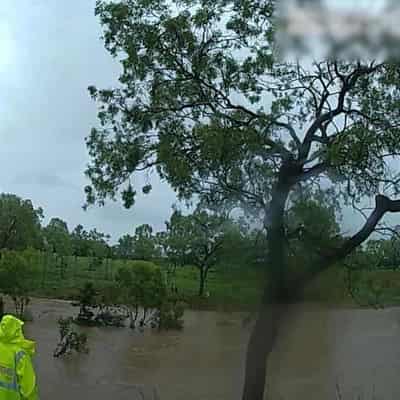 Children rescued in floodwaters as showers ease