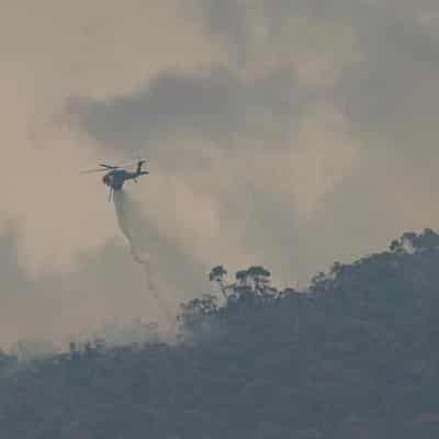 Bushfire rages but cool change a chance to check damage