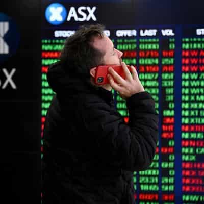 Aussie shares up, as festive shoppers come out in force