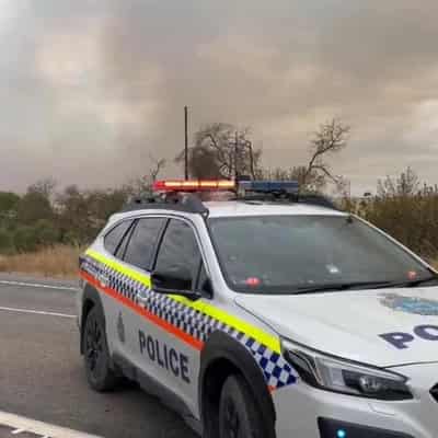 Bushfire threat finally eases but warnings to last days