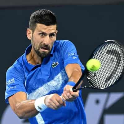 Djokovic downs Monfils for 20th time to reach quarters