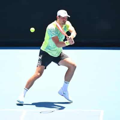 Tomic and Hewitt among early exits at Open qualifying